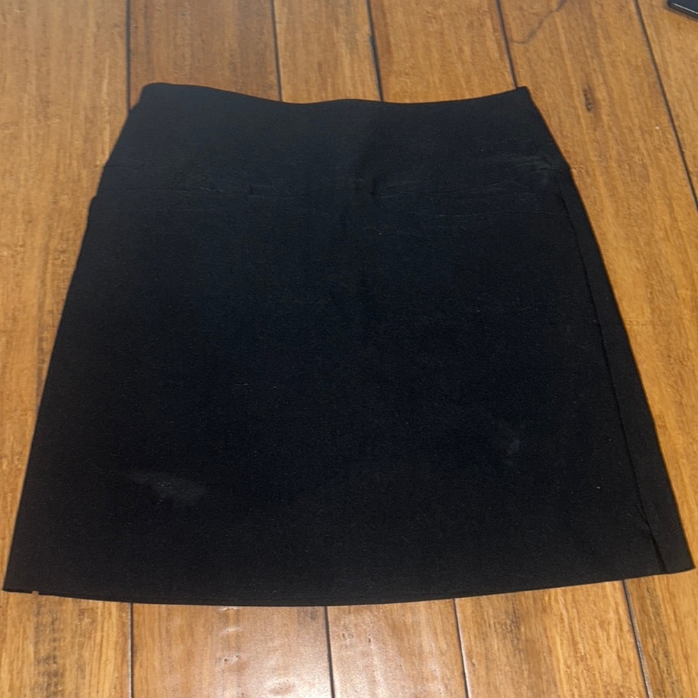 Black high waisted skirt with pockets and shorts underneath